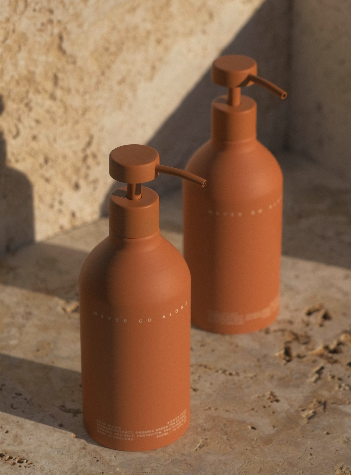 Never Go Alone Never Go Alone amenity bottles on stone